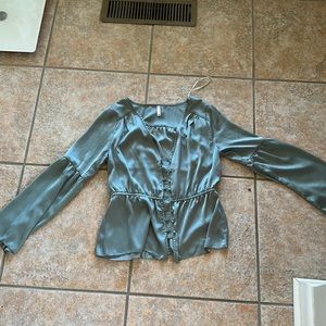 GF collection blouse in a muted sea foam green. Silky material